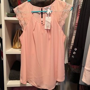 NWT cute sleeveless peach colored Candie’s top with lace accents